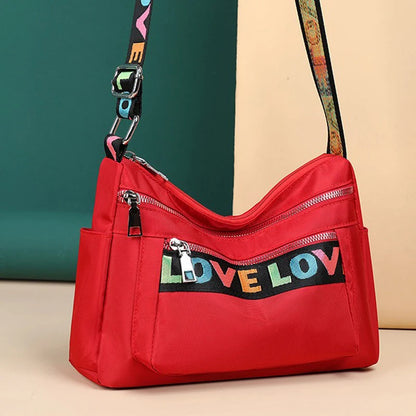 🍒Womens handbag oxford fabric bag large capacity crossbody with multiple compartments fashion accessory casual carry bag with colourful font Get A Handle On Love